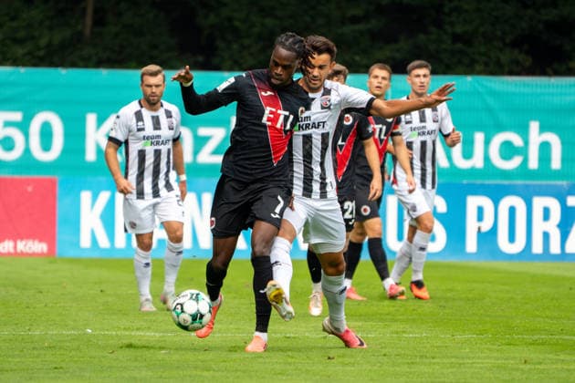 Deutschland: Fussball, 3. Liga, 2026 27, 7. Spieltag, 19.09.2026: FC Viktoria Köln vs. FC Ingolstadt 04: Sportpark Höhenberg (Köln): Joel Agyekum (FC Viktoria Köln, 3) im Zweikampf mit Fredrik Carlsen (FC Ingolstadt 04, 8) Köln Deutschland Copyright: xMijoxLubecx