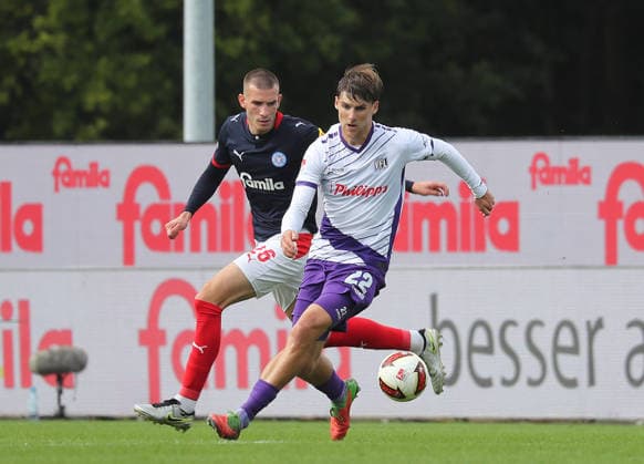 Duell zwischen Bernd Riesselmann (VfL Osnabrueck) und David Zec (Holstein Kiel) Fussball, Herren, Saison 2026 2027, 2.BL, Holstein Stadion, Holstein Kiel gegen VfL Osnabrueck, 1-1 DFL REGULATIONS PROHIBIT ANY USE OF PHOTOGRAPHS AS IMAGE SEQUENCES AND OR QUASI-VIDEO.
