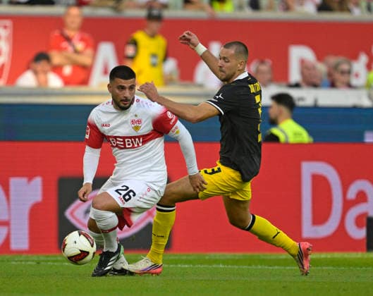 19.09.2026, Fussball 1. Bundesliga 2026 2027, 4.Spieltag, VfB Stuttgart - Borussia Dortmund, in der MHP-Arena Stuttgart, v.l. Deniz Undav (Stuttgart) gegen Waldemar Anton (Borussia Dortmund)