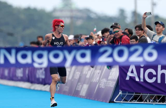 (260920) -- NAGOYA, Sept. 20, 2026 -- Hojo Takumi of Japan runs to the finish line during the men s individual triathlon final at the 20th Asian Games Aichi-Nagoya 2026 in Gamagori City of Aichi prefecture, Japan, Sept. 20, 2026. ) (SP)JAPAN-NAGOYA-ASIAN GAMES-TRIATHLON-MEN S INDIVIDUAL DengxHua 