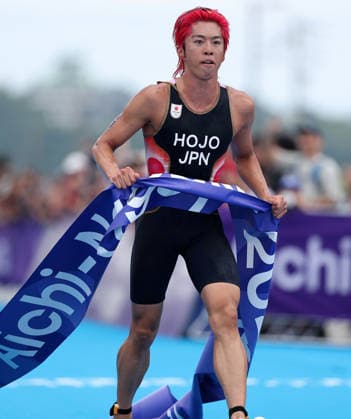 (260920) -- NAGOYA, Sept. 20, 2026 -- Hojo Takumi of Japan crosses the finish line during the men s individual triathlon final at the 20th Asian Games Aichi-Nagoya 2026 in Gamagori City of Aichi prefecture, Japan, Sept. 20, 2026. ) (SP)JAPAN-NAGOYA-ASIAN GAMES-TRIATHLON-MEN S INDIVIDUAL DengxHua 