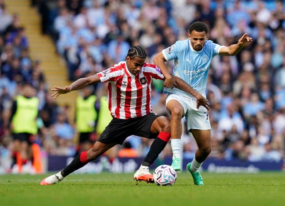 Manchester, England, 20th September 2026. Dayann Methalie of Sunderland tussles with Illiman Ndiaaye of Manchester City during the Manchester City vs Sunderland Premier League match at the Etihad Stadium, Manchester. Picture credit should read: Andrew Yates Sportimage EDITORIAL USE ONLY. No use with unauthorised audio, video, data, fixture lists, club league logos or live services. Online in-match use limited to 120 images, no video emulation. No use in betting, games or single club league player publications. SPI_038_AY_ManCity_Sunderland SPI-5012-0038