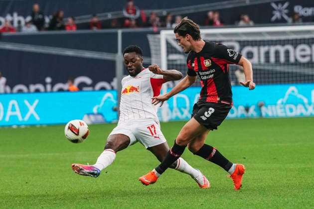 20.09.2026, xjmrgnx, Fussball 1.Bundesliga, Bayer 04 Leverkusen - RB Leipzig v.l. Ridle Baku (17, Leipzig) und Miguel Gutierrez (3, Leverkusen) im Kampf um den Ball (DFL DFB REGULATIONS PROHIBIT ANY USE OF PHOTOGRAPHS as IMAGE SEQUENCES and or QUASI-VIDEO) Leverkusen