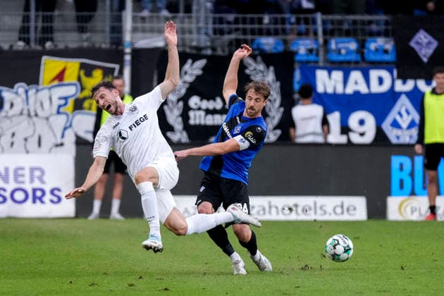 v.li.: Philipp Maier (Münster, 26), Lukas Klünter (SV Waldhof, 24, Kapitän), Zweikampf, Spielszene, Duell, duel, tackle, tackling, Dynamik, Action, Aktion, 20.09.2026, Mannheim (Deutschland), Fussball, 3. Liga, SV Waldhof Mannheim - SC Preußen Münster, DFB DFL REGULATIONS PROHIBIT ANY USE OF PHOTOGRAPHS AS IMAGE SEQUENCES AND OR QUASI-VIDEO.
