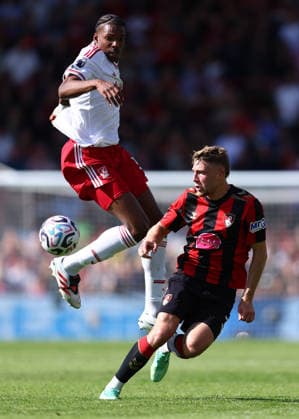 Bournemouth, England, 20th September 2026. Jeremy Jacquet of Liverpool and Adrien Truffert of AFC Bournemouth challenge for the ball during the AFC Bournemouth vs Liverpool Premier League match at the Vitality Stadium, Bournemouth. Picture credit should read: Paul Terry Sportimage EDITORIAL USE ONLY. No use with unauthorised audio, video, data, fixture lists, club league logos or live services. Online in-match use limited to 120 images, no video emulation. No use in betting, games or single club league player publications. SPI_043_PT_Bournemouth_Liverpool SPI-5013-0043