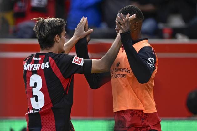 LEVERKUSEN - (lr) Miquel Gutierrez of Bayer 04 Leverkusen and Christian Kofane of Bayer 04 Leverkusen celebrate the goal by Miquel Gutierrez of Bayer 04 Leverkusen during the match between Bayer 04 Leverkusen and RB Leipzig at the Bay Arena on 20 September 2026 in Leverkusen, Germany. ANP Bundesliga 2026 27 xVIxANPxSportx xGerritxvanxKeulenxIVx 569419587 originalFilename: 569419587.jpg