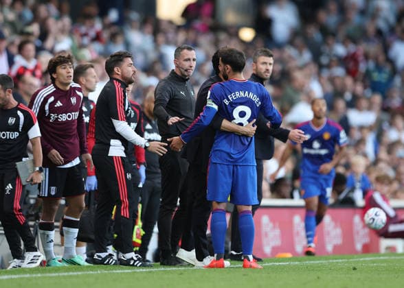20th September 2026; Craven Cottage, London, England; Premier League Football, Fulham versus Manchester United, ManU Bruno Fernandes of Manchester United arguing with the Fulham coaches while being held back by Fulham Manager Alvaro Arbeloa JohnxPatrickxFletcher