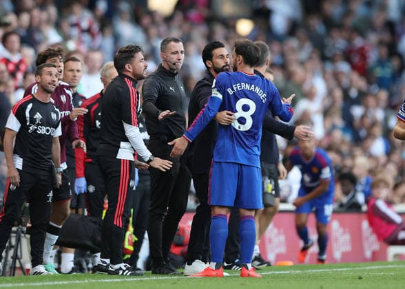 20th September 2026; Craven Cottage, London, England; Premier League Football, Fulham versus Manchester United, ManU Bruno Fernandes of Manchester United arguing with the Fulham coaches while being held back by Fulham Manager Alvaro Arbeloa JohnxPatrickxFletcher