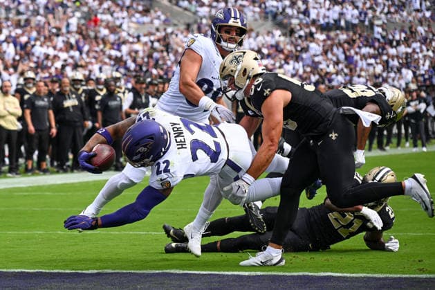 Baltimore Ravens running back Derrick Henry (22) runs past New Orleans Saints linebacker Kaden Elliss (55) for a 1 yard touchdown run during the first quarter of the Ravens home opener game at M&T Bank Stadium in Baltimore, Maryland, on Sunday, September 20, 2026.  BAL20260920120 DAVIDxTULIS