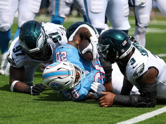 Sep 20, 2026; Nashville, TN, USA; Tennessee Titans running back Tony Pollard (20) is tackled by Philadelphia Eagles defensive tackle Moro Ojomo (97) and linebacker Nolan Smith Jr. (3) during the NFL, American Football Herren, USA regular season game between the Philadelphia Eagles and Tennessee Titans at Nissan Stadium. Mandatory Credit: -Cal Media Nashville USA - ZUMAc04_ 20260920_zma_c04_065 Copyright: xStephenxFurstx