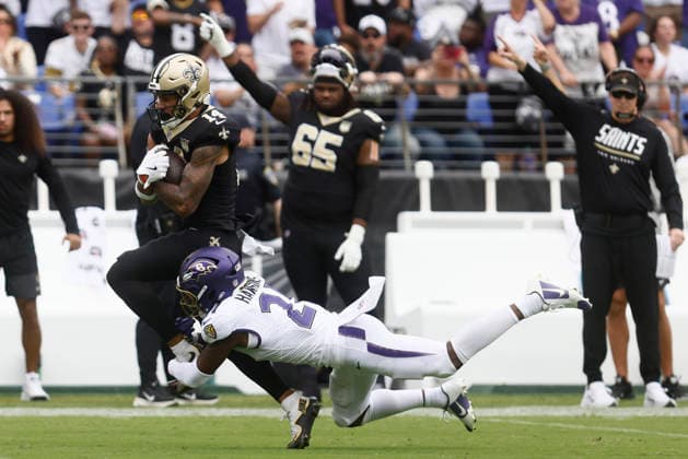 New Orleans Saints wide receiver Devaughn Vele (14) is tackled by Baltimore Ravens safety Jaylinn Hawkins (21) during an NFL, American Football Herren, USA game. Sep 20, 2026; Baltimore, MD, USA; at M&T Bank Stadium. New Orleans won 24-17. Mandatory Credit: -Cal Media NFL 2026: Saints Vs Ravens SEP 20  - ZUMAc04_ 20260920_zma_c04_203 Copyright: xMikexBuscherx