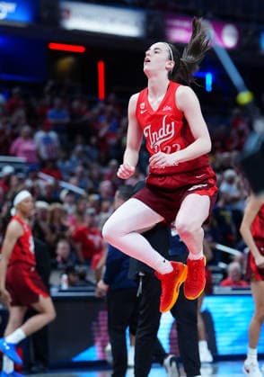 INDIANAPOLIS, IN - SEPTEMBER 20: Indiana Fever guard Caitlin Clark (22) jumps up to stretch her legs before the opening jump ball in her NIKE Caitlin 1 Sea of Red shoes before the game against the Washington Mystics on September 20, 2026, at Gainbridge Fieldhouse in Indianapolis, Indiana. (Photo by Brian Spurlock Icon Sportswire) WNBA, Basketball Damen, USA SEP 20 Washington Mystics at Indiana Fever EDITORIAL USE ONLY Icon26092021