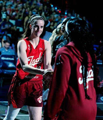 INDIANAPOLIS, IN - SEPTEMBER 20: Indiana Fever guard Caitlin Clark (22) gets a fist bump from guard Raven Johnson (3) as she is introduced in player introductions before the game against the Washington Mystics on September 20, 2026, at Gainbridge Fieldhouse in Indianapolis, Indiana. (Photo by Brian Spurlock Icon Sportswire) WNBA, Basketball Damen, USA SEP 20 Washington Mystics at Indiana Fever EDITORIAL USE ONLY Icon26092024