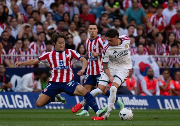 September 20, 2026, Madrid, Madrid, Spain: Real Madrid s FEDERICO VALVERDE is tackled by Atletico Madrid s KANG-IN LEE during their LaLiga Madrid derby soccer match at the Metropolitano Stadium in Madrid, Spain, September 20, 2026. VALVERDE sustained a severe left ankle injury from the challenge late in the first half. Madrid Spain - ZUMAd308 20260920_zsp_d308_060 Copyright: xJuanxCarlosxLucasx