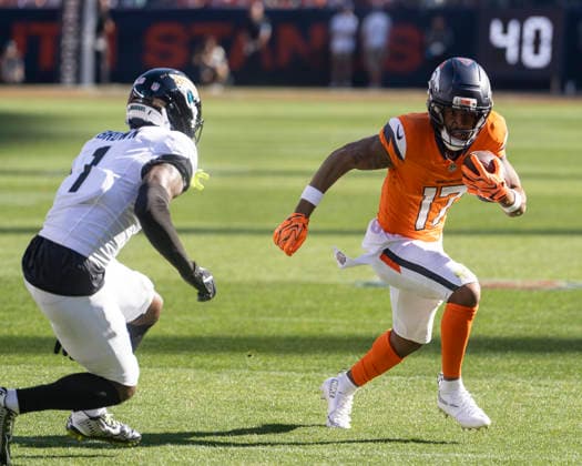 Sep 20, 2026; Denver Broncos wide receiver Jaylen Waddle (17) tries to avoid Jacksonville Jaguars cornerback Montaric Brown (1) during the game between the Denver Broncos and Jacksonville Jaguars in Denver, CO, USA; at Empower Field at Mile High. Mandatory Credit: -Cal Media NFL, American Football Herren, USA 2026: Jaguars Vs Broncos SEP 20  - ZUMAc04_ 20260920_zma_c04_257 Copyright: xDerekxRegensburgerx