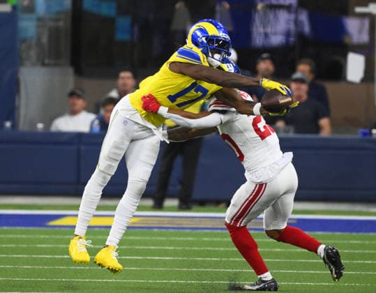 Los Angeles Rams receiver Davante Adams (17) catches the ball over New York Giants cornerback Greg Newsome II in second quarter action Monday Night Football at SoFi Stadium in Inglewood, California on Monday September 21, 2026. The Rams defeated the Giants 28-6.  LAP2026092112 JONxSOOHOO