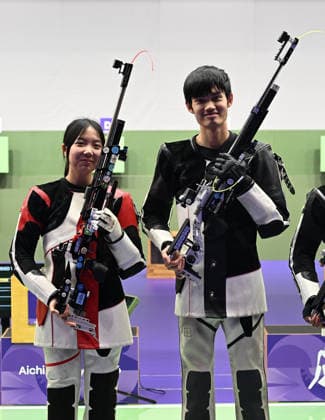 (260922) -- NAGOYA, Sept. 22, 2026 -- Wang Zifei and Sheng Lihao (R) of team China react after the 10m air rifle mixed team final of shooting at the 20th Asian Games Aichi-Nagoya 2026 in Toyota of Aichi Prefecture, Japan, Sept. 22, 2026. ) (SP)JAPAN-NAGOYA-ASIAN GAMES-SHOOTING-10M AIR RIFLE MIXED TEAM-FINAL LiuxLei 
