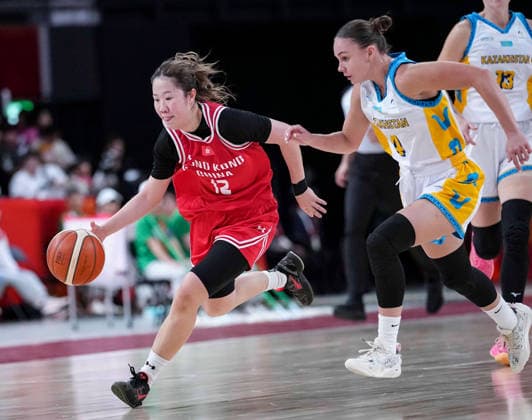 (260922) -- NAGOYA, Sept. 22, 2026 -- Kwan Hoi Pui (L) of Hong Kong, China breaks through during the women s group B match between Hong Kong, China and Kazakhstan at 20th Asian Games Aichi-Nagoya 2026 in Nagoya, Japan, Sept. 22, 2026. ) (SP)JAPAN-NAGOYA-ASIAN GAMES-BASKETBALL-WOMEN S GROUP B-HKG VS KAZ LuoxYuan 