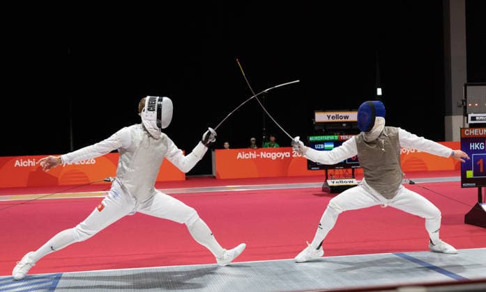 (260922) -- TOKONAME, Sept. 22, 2026 -- Cheung Ka Long (L) of China s Hong Kong competes against Daniil Kravtsov of Uzbekistan during the men s foil individual table of 32 of fencing at the 20th Asian Games Aichi-Nagoya 2026 in Tokoname, Aichi Prefecture, Japan, Sept. 22, 2026. ) (SP)JAPAN-TOKONAME-ASIAN GAMES-FENCINGMEN S FOIL INDIVIDUAL-TABLE OF 32 YaoxQilin 