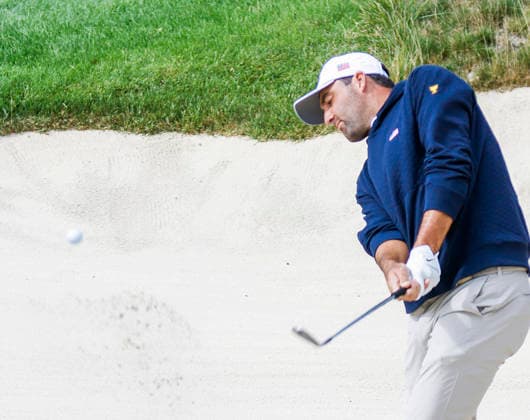 Scottie Scheffler of the US hits from a sand trap by the twelfth green during practice for the Presidents Cup golf tournament at Medinah Country Club in Medinah, Illinois on Tuesday, September 22, 2026. Competition between the USA and the International team begins on Thursday, September 24 with Four-Ball play.  MED20260922901 TANNENxMAURY