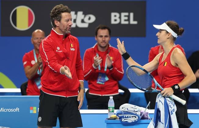 Begian Jana Otzipka and Belgian team captain Wim Fissette pictured during a tennis match between Ukrainian Kalinina and Belgian Otzipka, the first rubber in the tie between Belgium and Ukraine in the Quarter Finals of the Billie King Cup tournament, on Thursday 24 September 2026 in Shenzhen, China. VIRGINIExLEFOUR  x187638266x