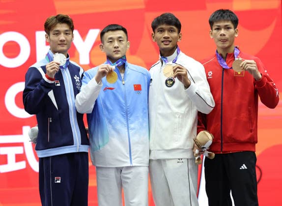 (260924) -- NAGOYA, Sept. 24, 2026 -- Gold medalist Tang Sishuo (2nd L) of China, silver medalist Leung Yu Hong (1st L) of Hong Kong, China and bronze medalists Bintang Reindra Nada Guitara (2nd R) of Indonesia and Hua Yan Doan of Vietnam pose during the victory ceremony for the men s 60kg of Wushu at the 20th Asian Games Aichi-Nagoya 2026 in Nagoya, Japan, Sept. 24, 2026. ) (SP)JAPAN-NAGOYA-ASIAN GAMES-WUSHU-MEN S 60KG FINAL LongxLei 