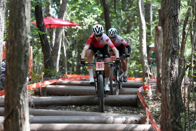 (260924) -- NAGOYA, Sept. 24, 2026 -- Wu Zhifan (front) and Liang Zhenglan of China compete during the women s cross-country final of cycling mountain bike at the 20th Asian Games Aichi-Nagoya 2026 in Nagoya, Japan, Sept. 24, 2026. ) (SP)JAPAN-NAGOYA-ASIAN GAMES-CYCLING MOUNTAIN BIKE-WOMEN S CROSS-COUNTRY FINAL CenxYunpeng 
