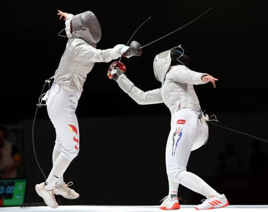 (260924) -- TOKONAME, Sept. 24, 2026 -- Pan Qimiao (L) of China competes against Zaynab Dayibekova of Uzbekistan during the women s sabre individual semifinal of fencing event at the 20th Asian Games Aichi-Nagoya 2026 in Tokoname, Aichi Prefecture, Japan, Sept. 24, 2026. ) (SP)JAPAN-TOKONAME-ASIAN GAMES-FENCING-WOMEN S SABRE YaoxQilin 