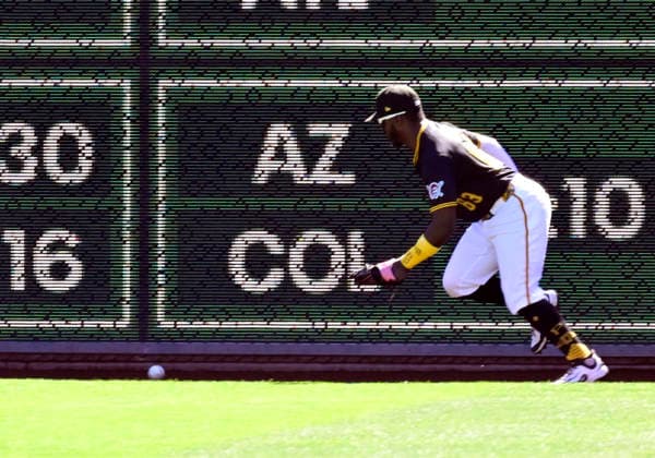 Pittsburgh Pirates right fielder Ronny Simon (63) chases a St. Louis Cardinals second baseman JJ Wetherholt hit off the wall giving JJ Wetherholt a double in the third inning at PNC Park on Thursday, Sept. 24, 2026 in Pittsburgh.  PIT2026092411 ArchiexCarpenter