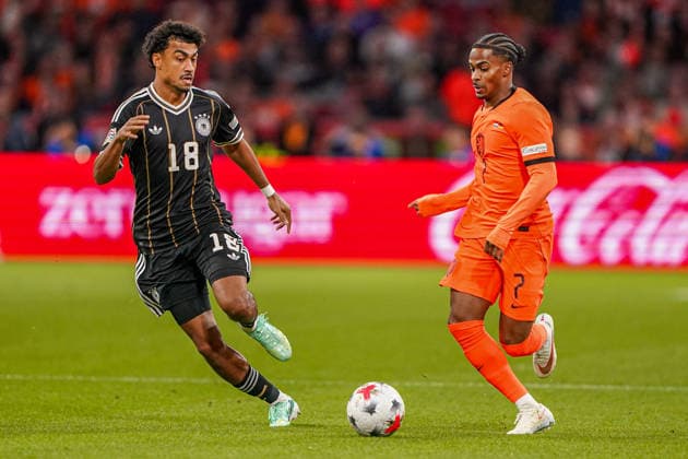 2026-09-24 Netherlands v Germany - Nations League AMSTERDAM, NETHERLANDS - SEPTEMBER 24: Nathaniel Brown of Germany battles for possession with Crysencio Summerville of the Netherlands during the Nations League match between Netherlands and Germany at Johan Cruijff ArenA Amsterdam Johan Cruijff ArenA Netherlands Content not available for redistribution in The Netherlands directly or indirectly through any third parties. Copyright: xAndrexWeeningx