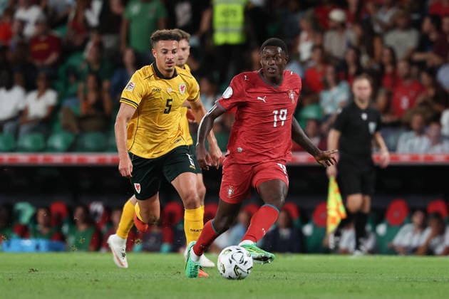 Lisbon, Portugal - September 24: Ethan Ampadu (Wales), Nuno Mendes (Portugal), in action, with the ball during the UEFA Nations League 2026 27 League Phase Matchday 1 match between Portugal and Wales at Estadio Jose Alvalade on September 24, 2026 in Lisbon, Portugal Copyright: HMBxMedia JoaquimxFerreira