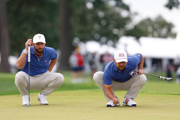 MEDINAH, IL - SEPTEMBER 24: Cameron Young of the United States and Xander Schauffele of the United States both squat to read a putt on No. 15 during the opening four ball session of the Presidents Cup, September 24, 2026, at Medinah Country Club in Medinah, Illinois. (Photo by Matthew Maxey Icon Sportswire) GOLF: SEP 24 Presidents Cup EDITORIAL USE ONLY Icon260924054