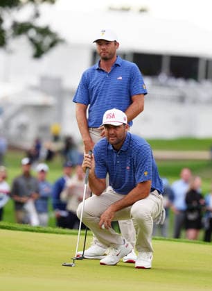 MEDINAH, IL - SEPTEMBER 24: Team USA golfers Scottie Scheffler and Sam Burns lines up a putt on the 17th hole during the first round of the 2026 Presidents Cup on September 24, 2026, at Medinah Country Club in Medinah, Illinois. (Photo by Brian Spurlock Icon Sportswire) GOLF: SEP 24 Presidents Cup EDITORIAL USE ONLY Icon260924116