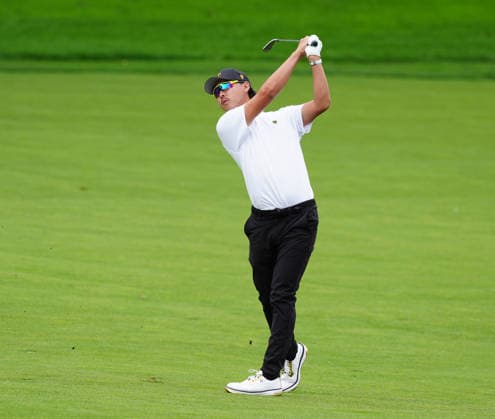 MEDINAH, IL - SEPTEMBER 24: Team International golfer Min Woo Lee plays his second shot on the 17th during the first round of the 2026 Presidents Cup on September 24, 2026, at Medinah Country Club in Medinah, Illinois. (Photo by Brian Spurlock Icon Sportswire) GOLF: SEP 24 Presidents Cup EDITORIAL USE ONLY Icon260924120