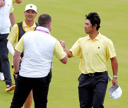 MEDINAH, IL - SEPTEMBER 25: Team International golfer Hideki Matsuyama congratulated by vice captain Taylor Pendrith after making a birdie putt and winning the match on the 16th hole during the second round of the 2026 Presidents Cup on September 25, 2026, at Medinah Country Club in Medinah, Illinois. (Photo by Brian Spurlock Icon Sportswire) GOLF: SEP 25 Presidents Cup EDITORIAL USE ONLY Icon26092553