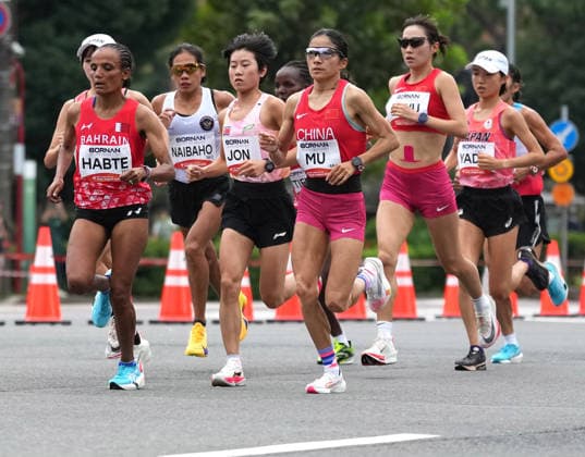 (260926) -- NAGOYA, Sept. 26, 2026 -- Athletes compete during the women s marathon final of Athletics at the 20th Asian Games Aichi-Nagoya 2026 in Nagoya, Japan, Sept. 26, 2026. ) (SP)JAPAN-NAGOYA-ASIAN GAMES-ATHLETICS-WOMEN S MARATHON JiaxYuchen 