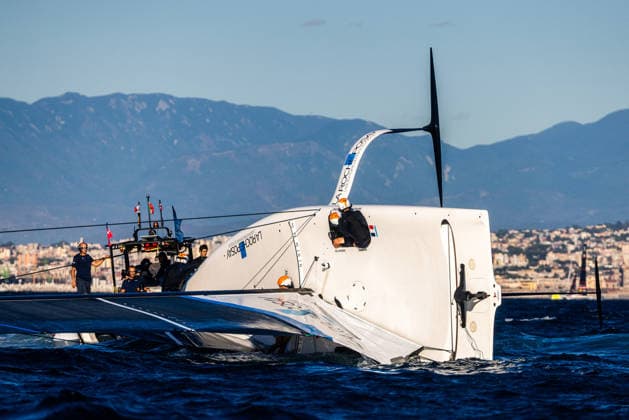 La Roche-Posay Racing Team capsized on the start line for Race 2 of Day 1. Louis Vuitton 38th America s Cup Preliminary Regatta, Naples, Italy. Friday 25 September 2026. Photo: Georgia Schofield NZ Naples Italy Copyright: xx