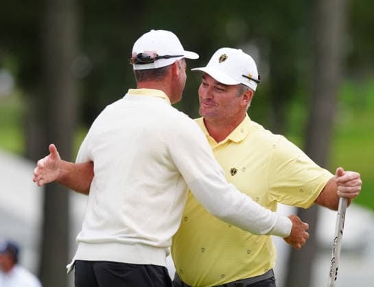 MEDINAH, IL - SEPTEMBER 25: Team International golfer Ryan Fox on right is congratulated by Corey Conners after winning the match on the 18th hole during the second round of the 2026 Presidents Cup on September 25, 2026, at Medinah Country Club in Medinah, Illinois. (Photo by Brian Spurlock Icon Sportswire) GOLF: SEP 25 Presidents Cup EDITORIAL USE ONLY Icon260925113