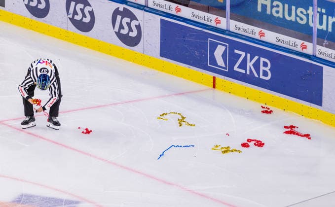 Ice hockey, Eishockey National League Regular Season - ZSC Lions vs EHC Klo Zurich, Switzerland, 26th Sep 2026: Linesman 37 Dominik Bichsel is clearing up on the ice. A game interruption was necessary early on due to objects lying on the ice. Copyright: xAndreasxHaasx