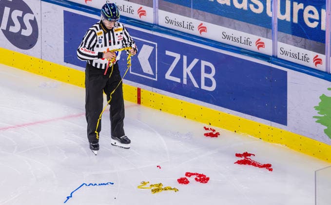 Ice hockey, Eishockey National League Regular Season - ZSC Lions vs EHC Klo Zurich, Switzerland, 26th Sep 2026: Linesman 37 Dominik Bichsel is clearing up on the ice. A game interruption was necessary early on due to objects lying on the ice. Copyright: xAndreasxHaasx