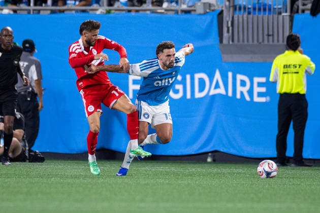 September 26, 2026: Charlotte FC defense Harry Toffolo (15) battles with Chicago Fire FC forward Philip Zinckernagel (11) during the first half of the MLS, Fussball Herren, USA match up at Bank of America Stadium in Charlotte, NC. Mandatory Credit: -Cal Media Charlotte United States - ZUMAc04_ 20260926_zma_c04_395 Copyright: xScottxKinserx