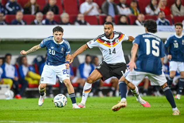 Christos Zafeiris (Greece), Josha Vagnoman (Germany) and Thanasis Androutsos (Greece) battle for the ball during the UEFA Nations League 2026 27 group phase match between Germany and Greece at WWK Arena on September 27, 2026 in Augsburg, Germany. (Photo by Harry Langer DeFodi Images) -