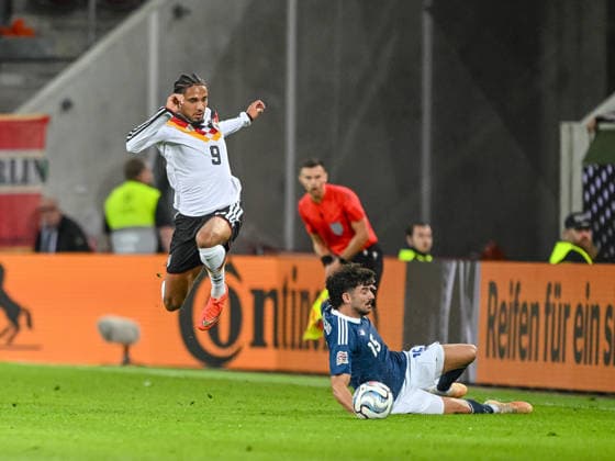 Kevin Schade (Germany) and Thanasis Androutsos (Greece) battle for the ball during the UEFA Nations League 2026 27 group phase match between Germany and Greece at WWK Arena on September 27, 2026 in Augsburg, Germany. (Photo by Harry Langer DeFodi Images) -