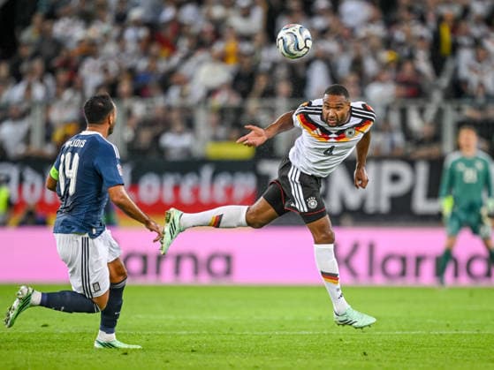 Vangelis Pavlidis (Greece) and Jonathan Tah (Germany) battle for the ball during the UEFA Nations League 2026 27 group phase match between Germany and Greece at WWK Arena on September 27, 2026 in Augsburg, Germany. (Photo by Harry Langer DeFodi Images) -