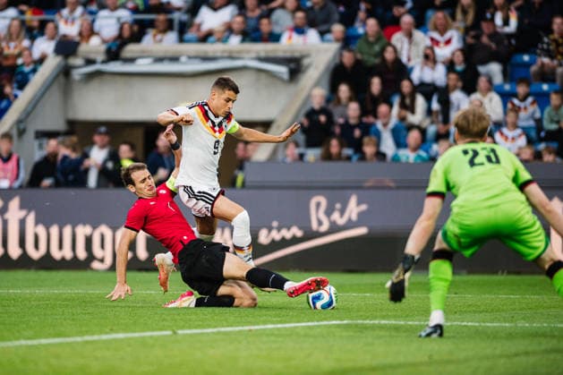 U21, U 21 EM-Qualifikation: Deutschland - Georgien, 06.10.2026 NicolÃ² Tresoldi (Deutschland, 9) wird von Aleksandre Narimanidze (Georgien, 4) weggegrätscht; Fußball, EM-Qualifikation U 21, 10. Spieltag: Deutschland vs. Georgien am 06.10.2026, Bielefeld DFB REGULATIONS PROHIBIT ANY USE OF PHOTOGRAPHS AS IMAGE SEQUENCES AND OR QUASI-VIDEO. Copyright: xBEAUTIFULxSPORTS Tonhäuserx