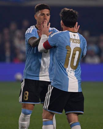 BUENOS AIRES, ARGENTINA - OCTOBER 06 : Forward Lionel Messi 10 of Argentina high-fives teammate Enzo Fernandez 8 during an International Friendly, Länderspiel, Nationalmannschaft match against Benin at Estadio Monumental on October 06, 2026 in Buenos Aires, Argentina. This historic match marks the final international appearance who wore a commemorative special-edition kit replacing the traditional manufacturer branding with his personal signature logo. Photo by SFSI Argentina national team, Nationalteam v Benin Copyright: xSFSIx
