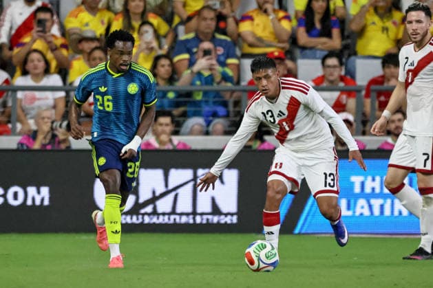 MIAMI, FL - OCTOBER 06: Marco Huaman 3 of Peru and Carlos Andres Gomez 26 of Colombia battle for a ball during an International Friendly, Länderspiel, Nationalmannschaft soccer match between Colombia and Peru at NU Stadium on October 06, 2026 in Miami, Florida.(Photo by Chris Arjoon Icon Sportswire) SOCCER: OCT 06 Colombia vs Peru EDITORIAL USE ONLY Icon2610060000030