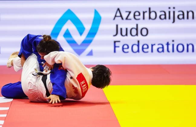 AZERBAIJAN, BAKU - OCTOBER 7, 2026: Kerem Primo (L) of Israel and Haruka Kaju of Japan compete in a -63 kg bout as part of the 2026 World Judo Championships at the National Gymnastics Arena 2026 World Judo Championships In Baku  - ZUMAt113 20261007_zaa_t113_417 Copyright: xMikhailxSinitsynx
