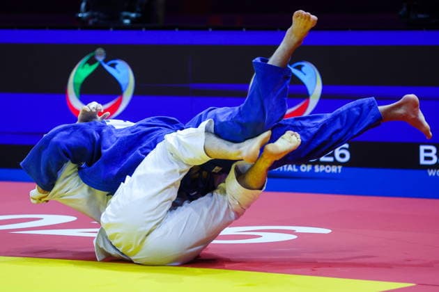 AZERBAIJAN, BAKU - OCTOBER 7, 2026: Abylaikhan Zhubanazar (top) of Kazakhstan and Omar Radzhabli of Azerbaijan compete in their -81 kg bout as part of the 2026 World Judo Championships at the National Gymnastics Arena. Mikhail Sinitsyn TASS  98914648