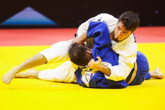 AZERBAIJAN, BAKU - OCTOBER 7, 2026: Omar Radzhabli (top) of Azerbaijan and Abylaikhan Zhubanazar of Kazakhstan compete in their -81 kg bout as part of the 2026 World Judo Championships at the National Gymnastics Arena. Mikhail Sinitsyn TASS  98915553